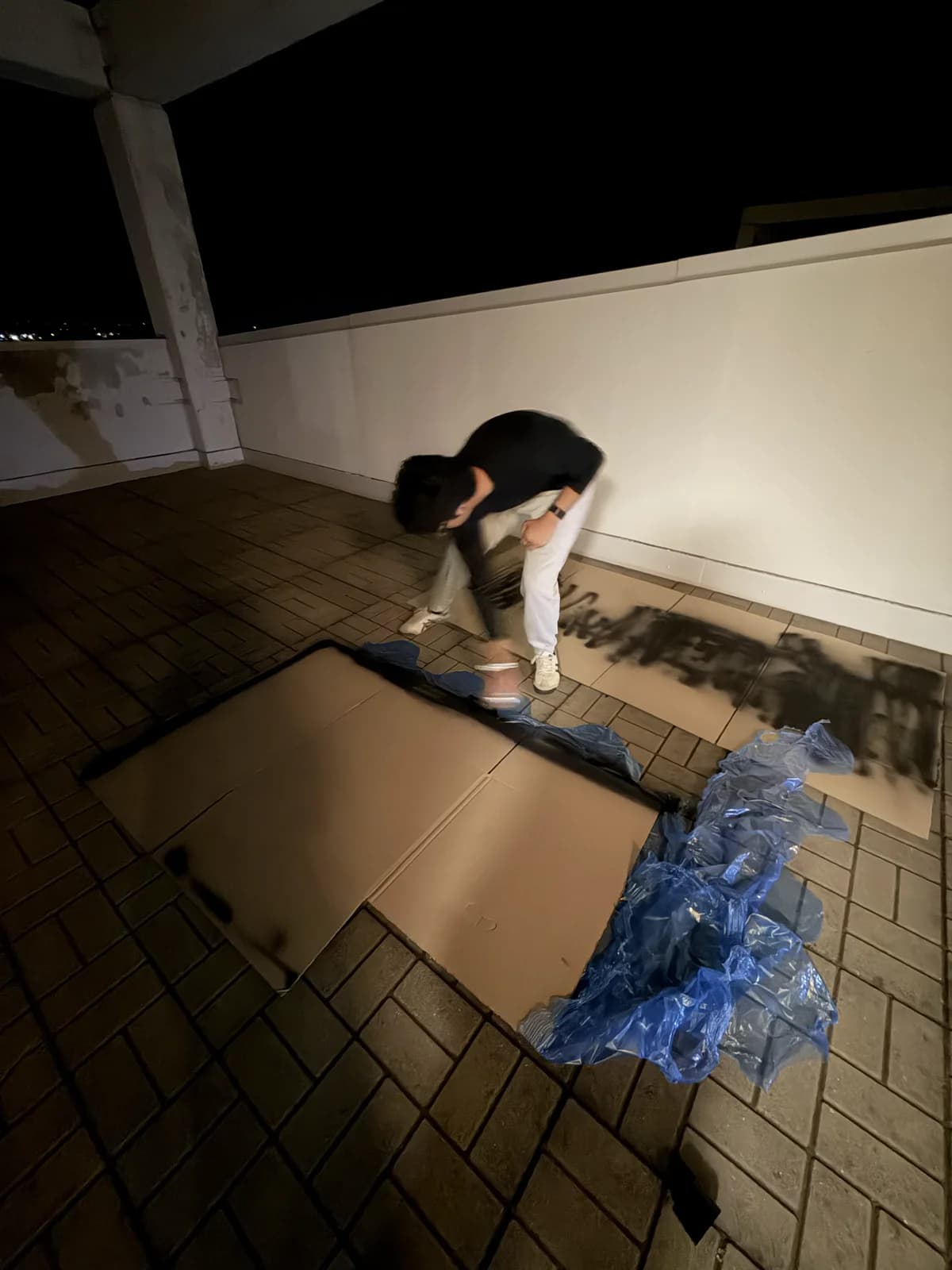 Spray painting the cardboard shell.