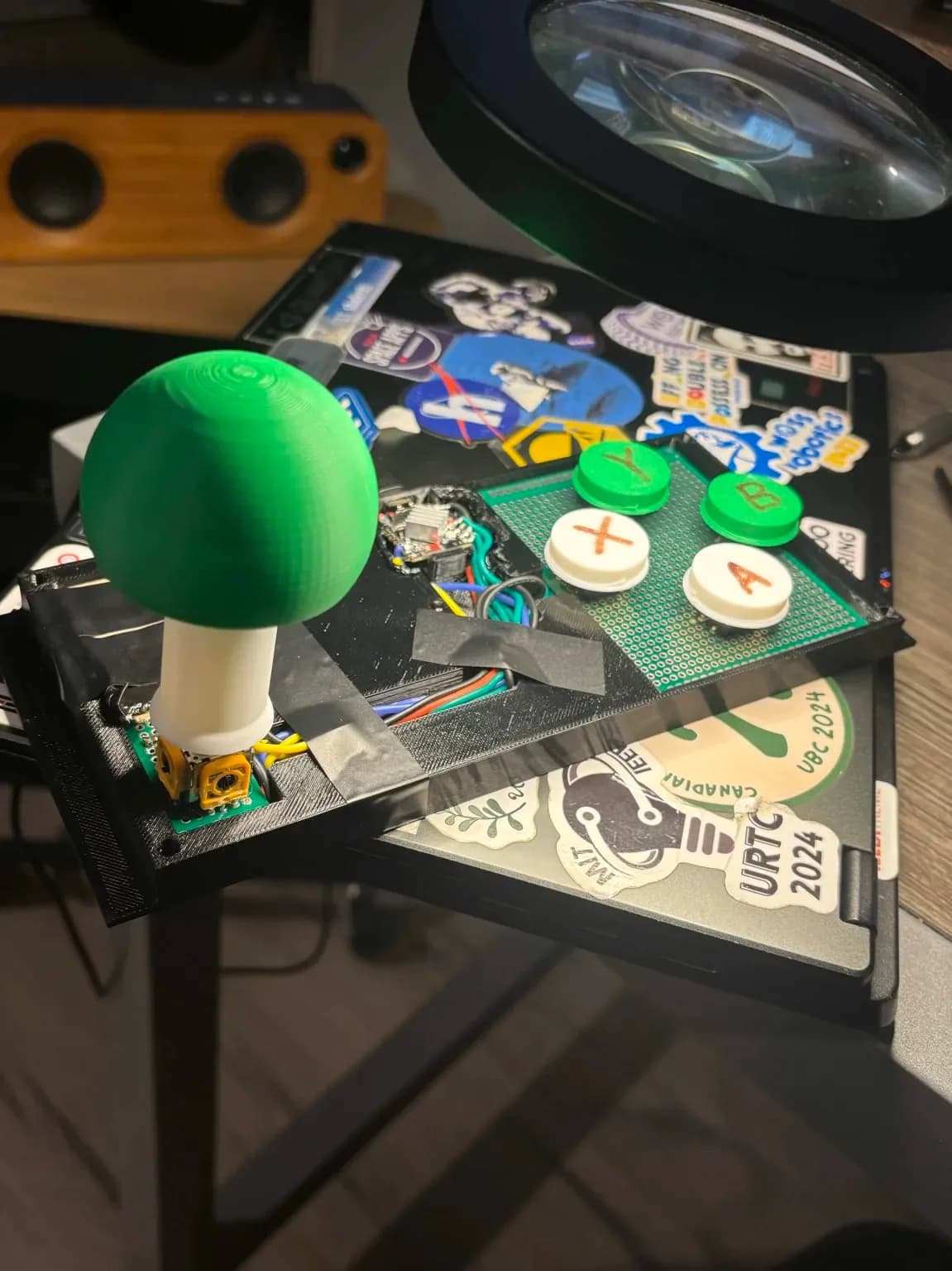 The custom joystick and button assembly.