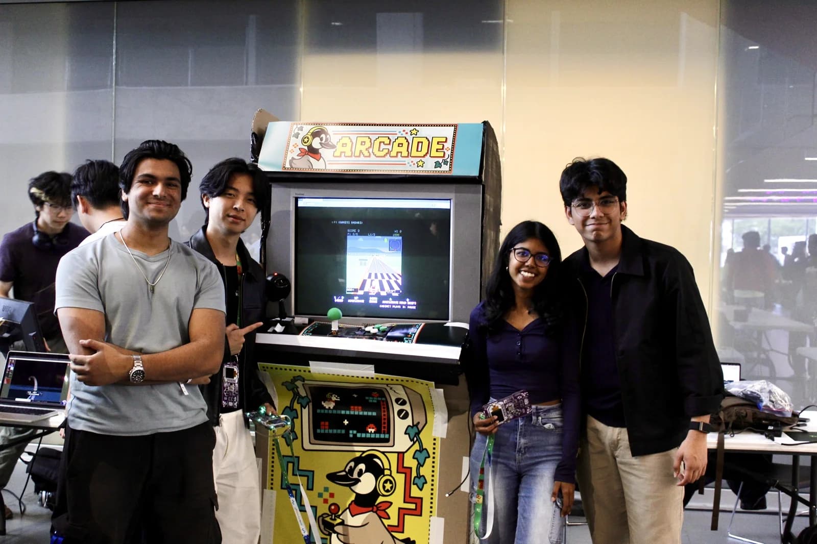 The Murph-E team beside the arcade at Hack the North.