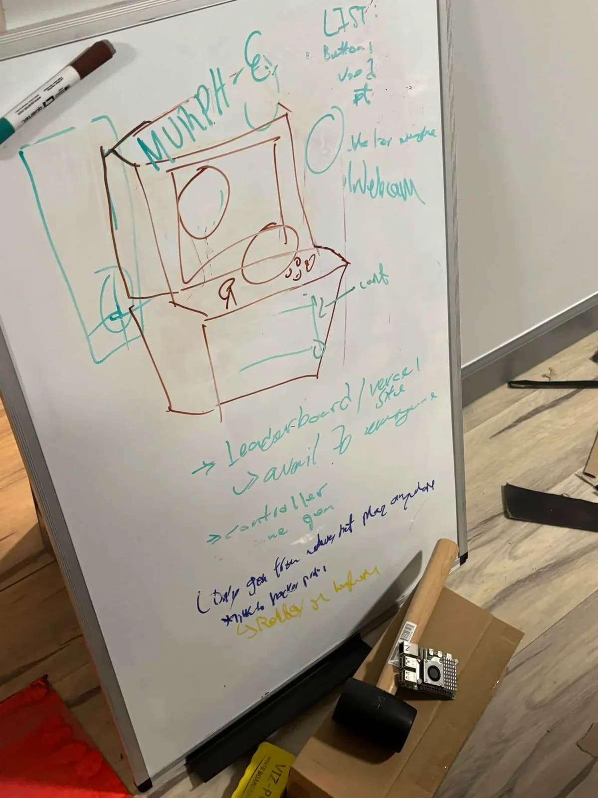 Initial whiteboard sketch of Murph-E’s arcade cabinet and controls.